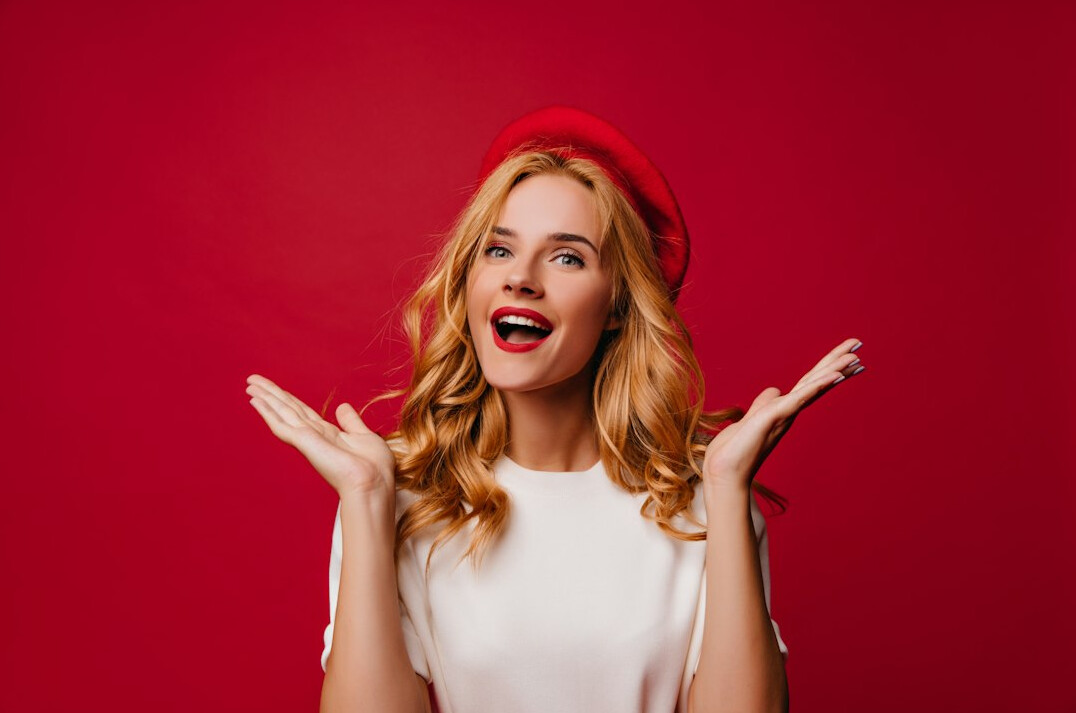 Portrait of a smiling British woman television presenter in a studio