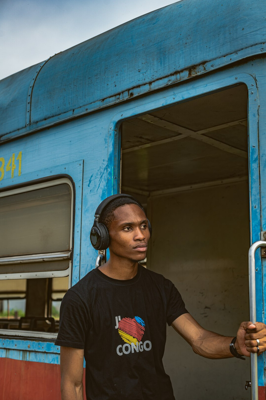Portrait of a smiling Black man broadcast engineer wearing a headset